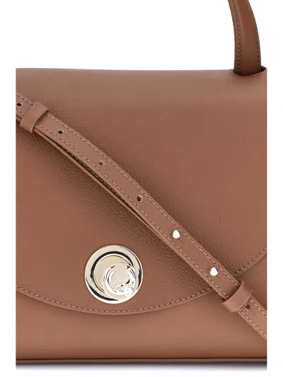 Coccinelle Curved Top Handbag With Circular Detail And Detachable Shoulder Strap In Brown