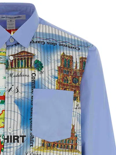 Comme Des Garçons Asymmetric Hem Shirt With Vibrant Landmark Prints In Blue