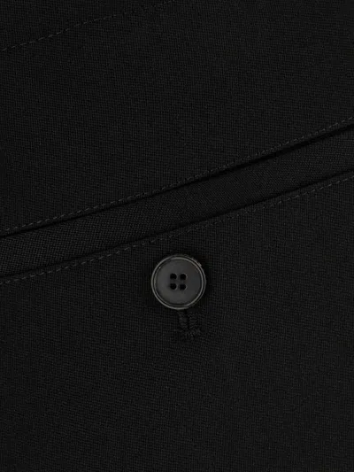 Givenchy Wool Trousers With Pleated Design And Button Detail In Black