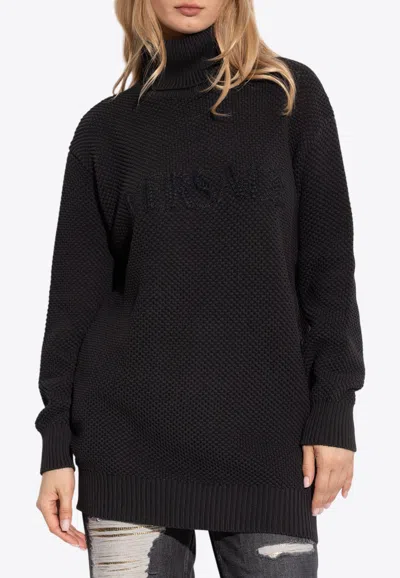 Versace Debossed Logo Turtleneck Sweater In Black