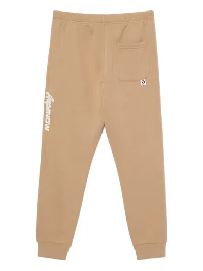Aape By A Bathing Ape Moonface Track Trousers In Neutral