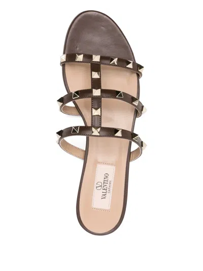Valentino Rockstud Slide Sandal In Laminated Nappa With Cabochon In Brown