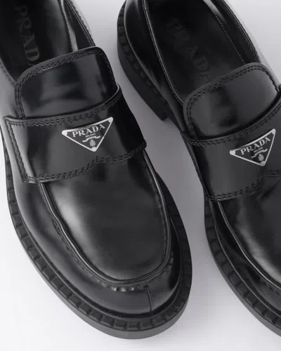 Prada Triangle Logo Brushed Leather Loafers In Black
