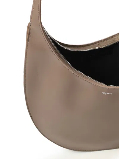 Coperni Medium Soft Swipe Shoulder Bag With Rounded Silhouette In Brown