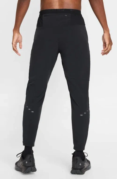 Nike Stride Dri-fit Woven Running Pants In Black