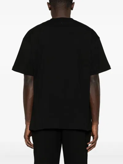 Represent "initial Oversized" T-shirt Clothing In Black