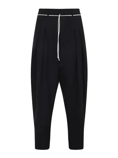 Mordecai Tapered Black Trousers With Pleated Front In Black