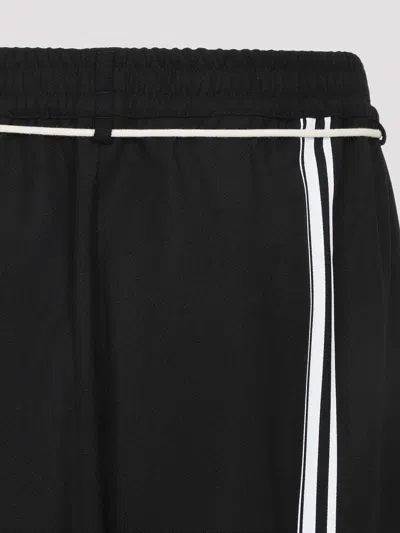 Mordecai Tapered Black Trousers With Pleated Front In Black