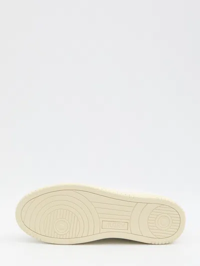 Autry Low-top Sneakers With Suede Inserts And Contrasting Heel In White