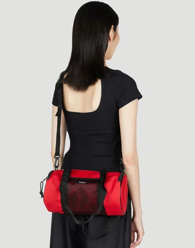 Eastpak X Telfar Medium Duffle Logo Patch Shoulder Bag In Red