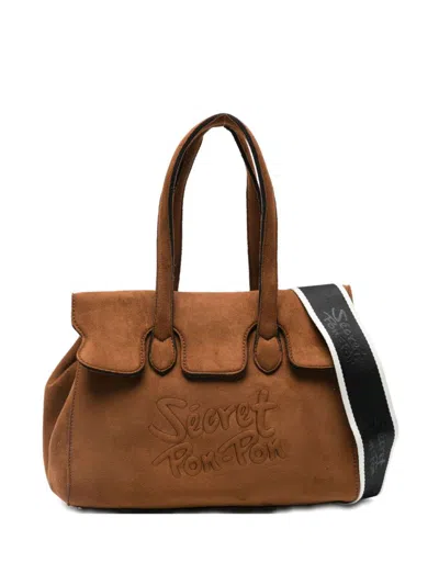 Secret Pon-pon Secret Pon Pon Crossbody Bag With Embossed Logo In Brown