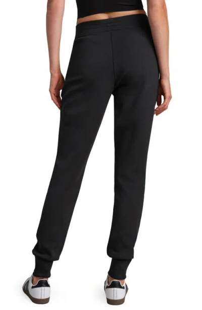 Rhone Dreamglow Taper Leg Pants In Black