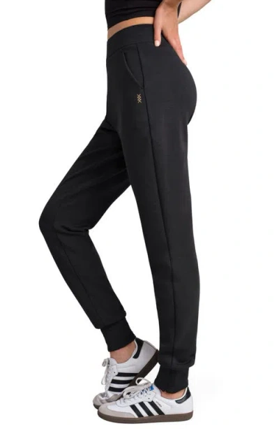 Rhone Dreamglow Taper Leg Pants In Black
