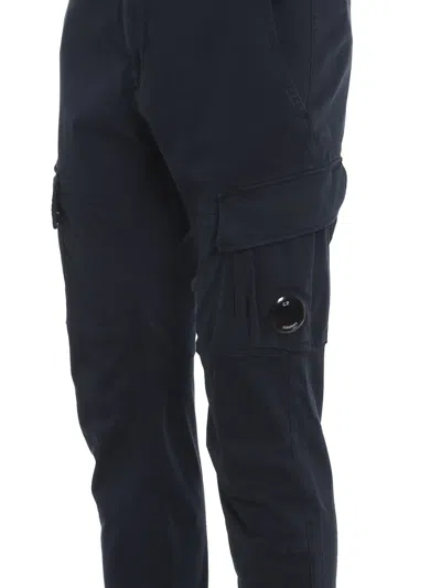 C.p. Company Streamlined Black Cargo Pants With Functional Pockets And Logo Detail In Blue