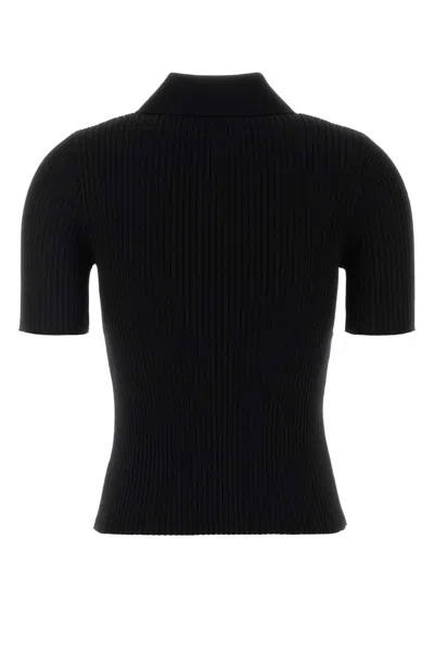 Courrèges Ribbed Short-sleeved Polo Shirt With Buttoned Placket In Black