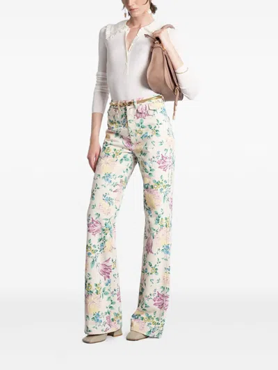 Chloé Flare Denim Jeans With All-over Flowers Print In Multi