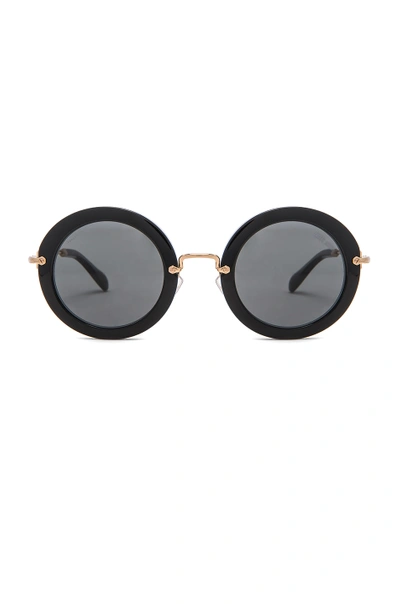 Shop Miu Miu Circle Sunglasses In Black