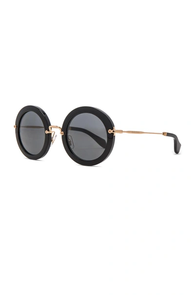 Shop Miu Miu Circle Sunglasses In Black