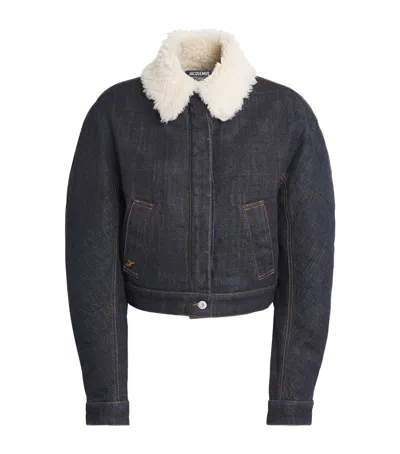 Jacquemus Le Bomber De-nimes Ovalo Blue Jacket With Fur Collar And Two Front Welt Pockets In Denim Woman In Blue