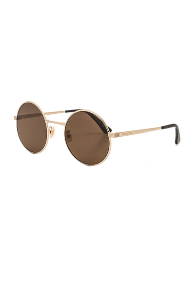 Shop Saint Laurent Sl 136 Zero Sunglasses In Antique Gold & Brown
