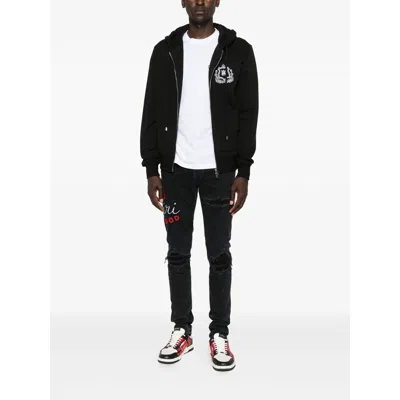 Amiri Casual Trousers With Five Pockets And Embroidery In Black