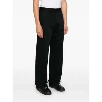 Axel Arigato Logo-tag Trousers In Black
