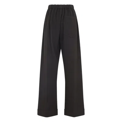 Carven Wide-leg Wool Trousers With Elastic Waistband And Buttoned Details In Black