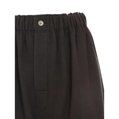 Carven Wide-leg Wool Trousers With Elastic Waistband And Buttoned Details In Black