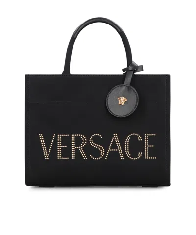 Versace Studded Logo Canvas Tote Bag In Black