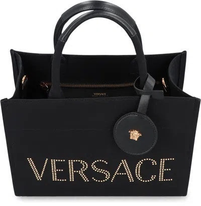 Versace Studded Logo Canvas Tote Bag In Black