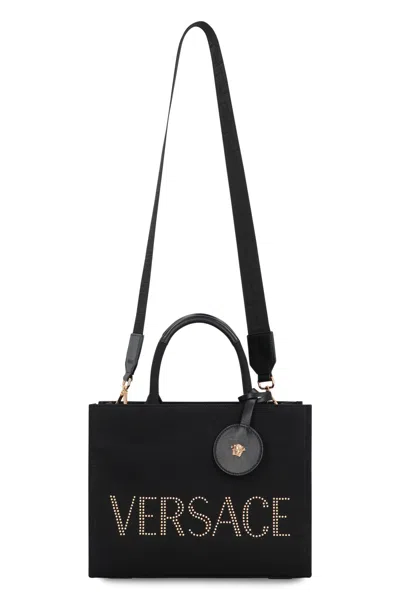 Versace Studded Logo Canvas Tote Bag In Black