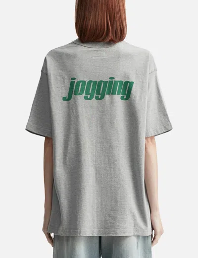 Unlikely Authentic Graphic Tee "jogging" In Gray