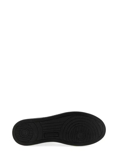 Autry Low-top Leather Sneakers With Navy Overlays And Perforated Details In Black