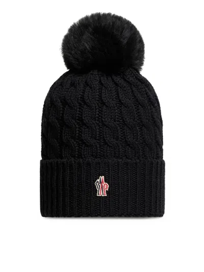 Moncler Wool Hat Featuring Cable Knit And Pom Detail In Black