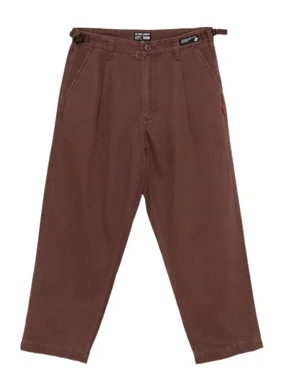 Izzue Logo-patch Trousers In Brown
