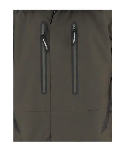 And Wander 2.5l Hiker Rain Jacket In Brown