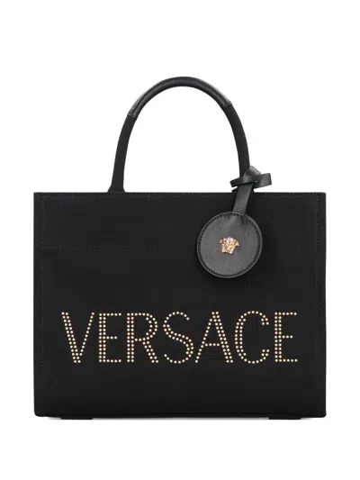 Versace Studded Logo Canvas Tote Bag In Black