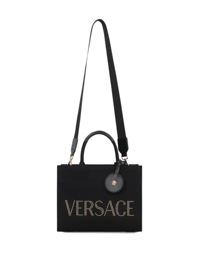 Versace Studded Logo Canvas Tote Bag In Black