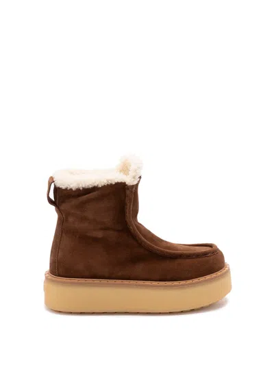 Prada Platform Booties Featuring Shearling Lining In Brown