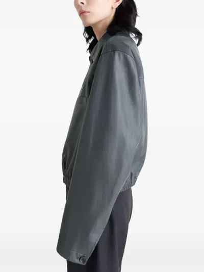 Lemaire Buttoned-up Elasticated Leather Jacket In Gray