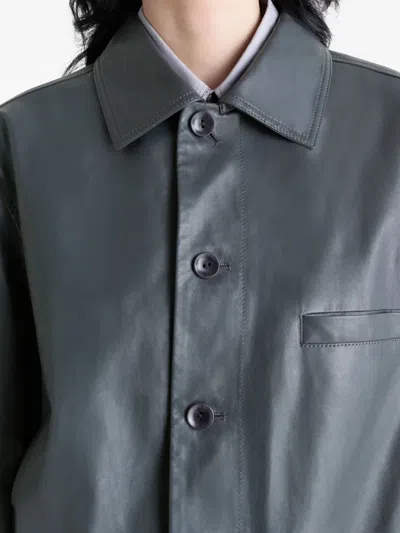 Lemaire Buttoned-up Elasticated Leather Jacket In Gray