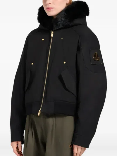 Moose Knuckles Fitted Hooded Jacket With Plush Fur Trim And Metallic Accents In Black