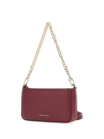 Michael Kors Bryant Bordeaux Crossbody Bag With Adjustable Shoulder Strap And Logo Lettering On The Front In Grai In Red
