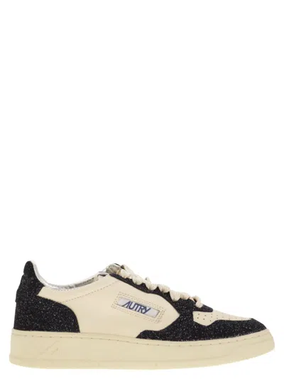 Autry Sparkling Low Top Sneakers With Perforated Toe In Black