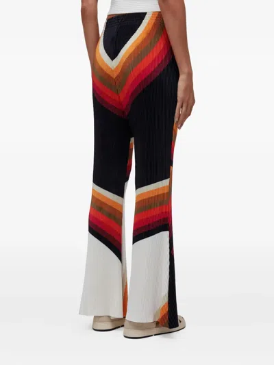 Osklen Geometric-pattern Trousers In Red