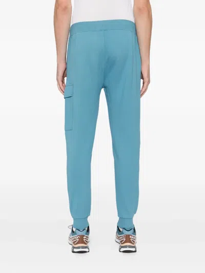C.p. Company Logo-plaque Cotton Track Pants In Blue