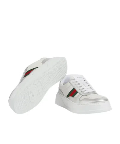 Gucci Low-top Leather Sneakers Featuring Metallic Accents And Rubber Sole In White