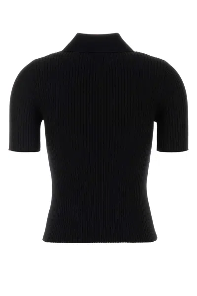 Courrèges Ribbed Short-sleeved Polo Shirt With Buttoned Placket In Black