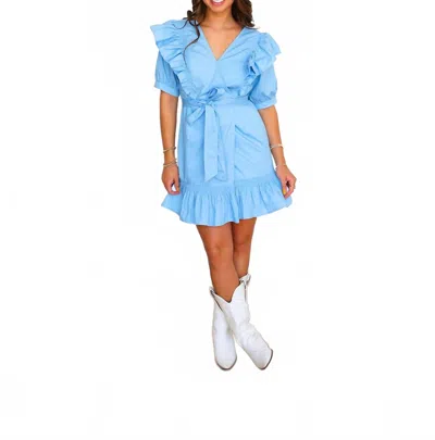 Karlie Solid Poplin Wrap Ruffle Mini Dress In Blue In Blue