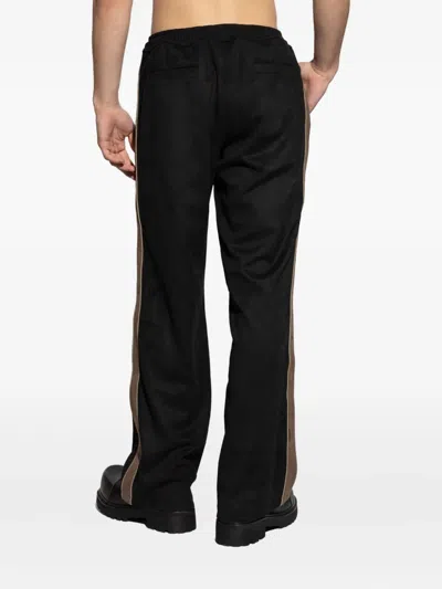 Misbhv Logo-embossed Track Pants In Black